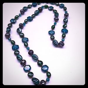 Blue, green, and turquoise beaded necklace.